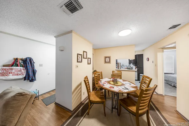 a dining room with furniture and window