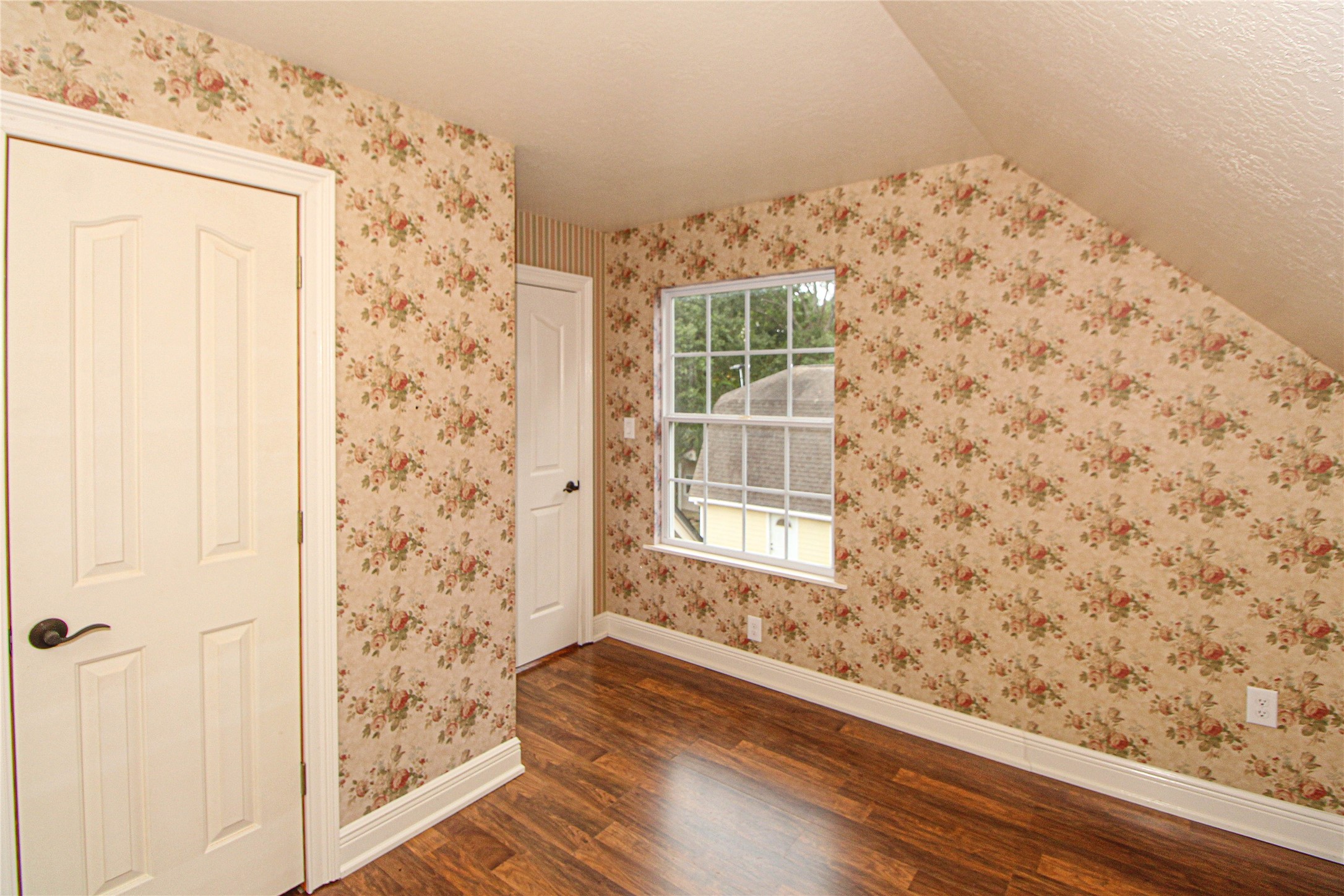 139 Berts Farm Road Livingston, TX 77351 - Photo 19 of 41 a view of a room with wooden floor and a window