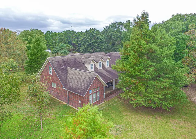 a view of a two chairs in a backyard