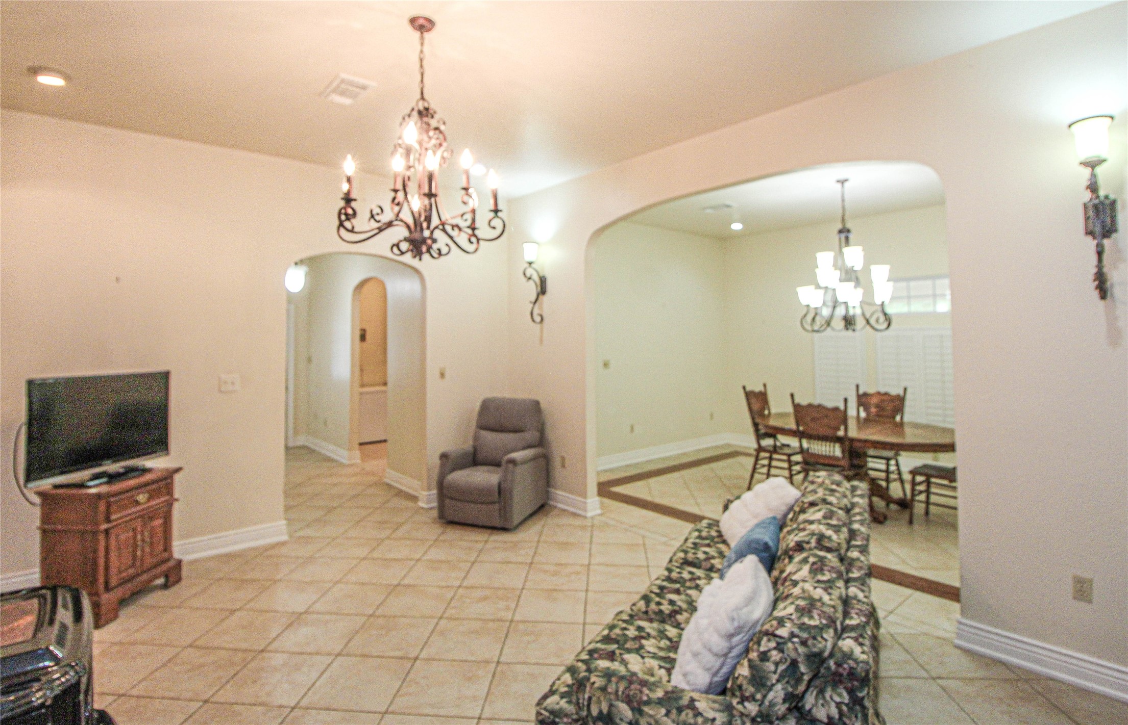 139 Berts Farm Road Livingston, TX 77351 - Photo 4 of 41 a view of a dining room with furniture and chandelier