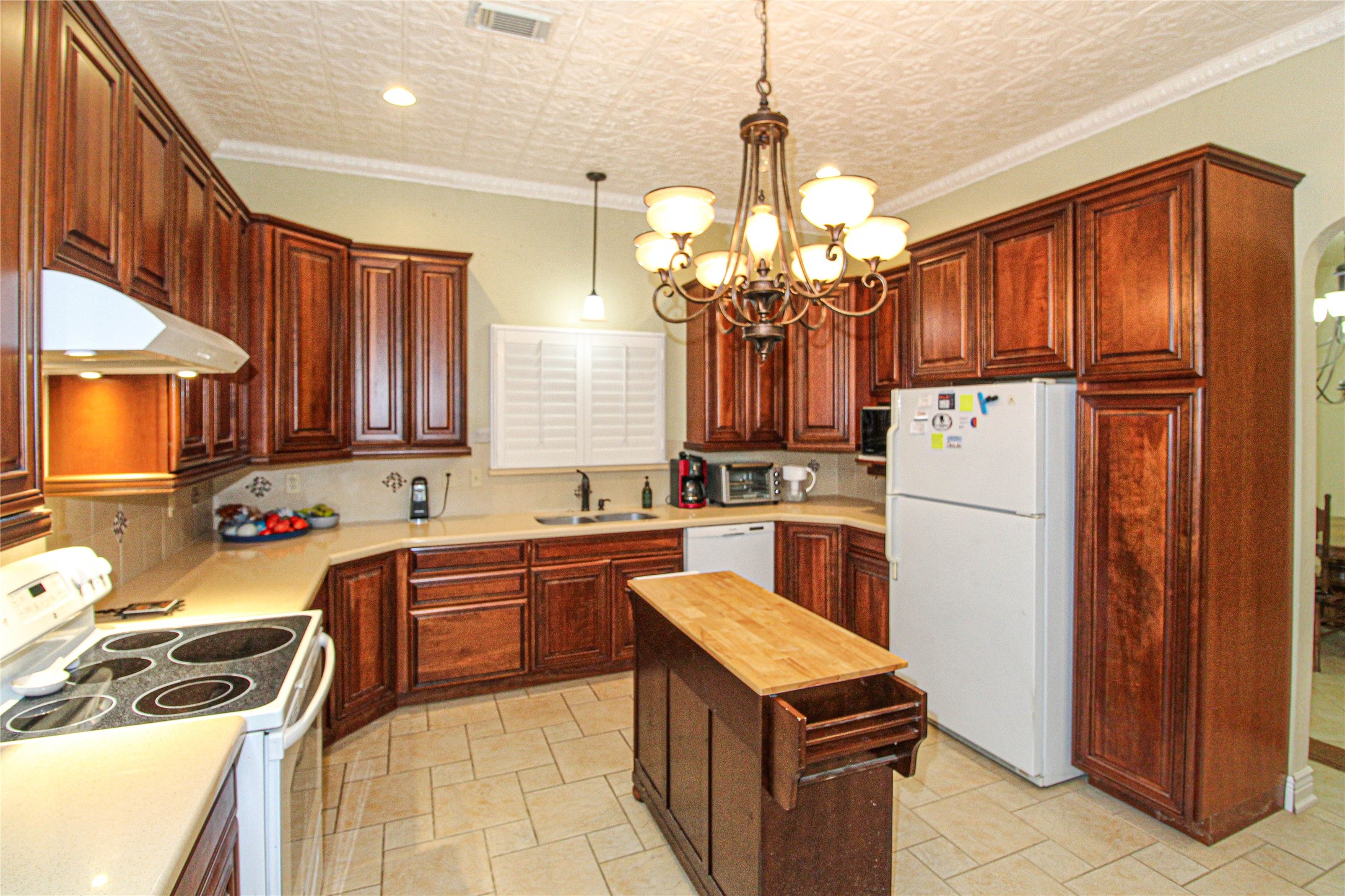 139 Berts Farm Road Livingston, TX 77351 - Photo 8 of 41 a kitchen with refrigerator cabinets and a sink