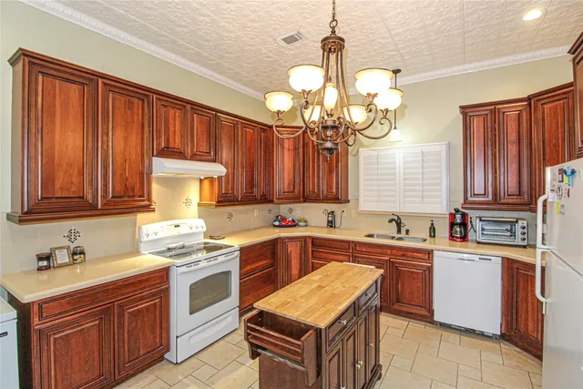 a kitchen with a sink stove and cabinets
