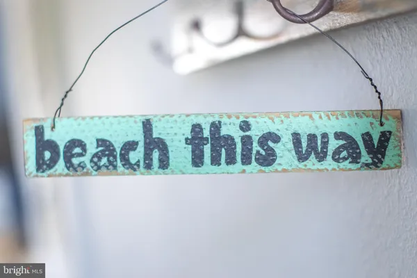 a living room with furniture a flat screen tv and a window