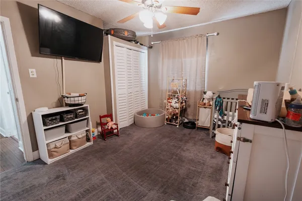 a room with furniture and a flat screen tv