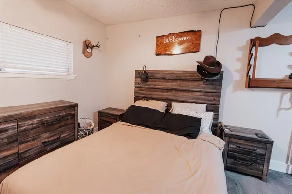 a bedroom with a bed and a dresser