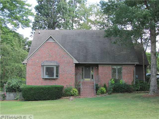 6100 Meadow Bluff Lane Oak Ridge, NC 27310 - Photo 1 of 16 Exterior Front. Cottage-style home on serene wooded lot with extensive landscaping