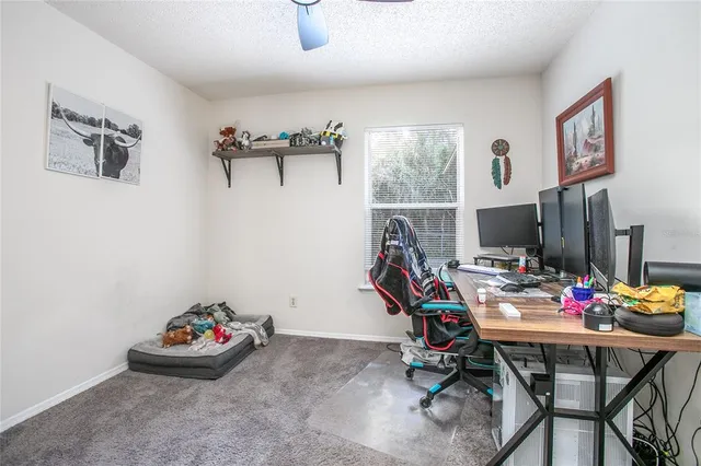 a view of a workspace with furniture