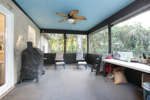 a room with furniture and a large window