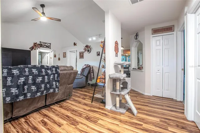 a view of a livingroom with furniture and wooden floor