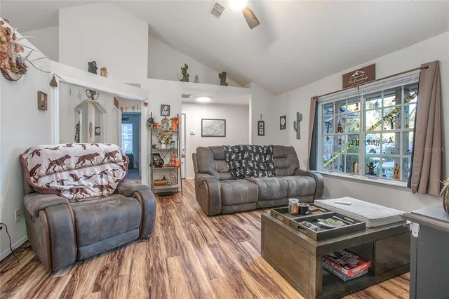 a living room with furniture and a window
