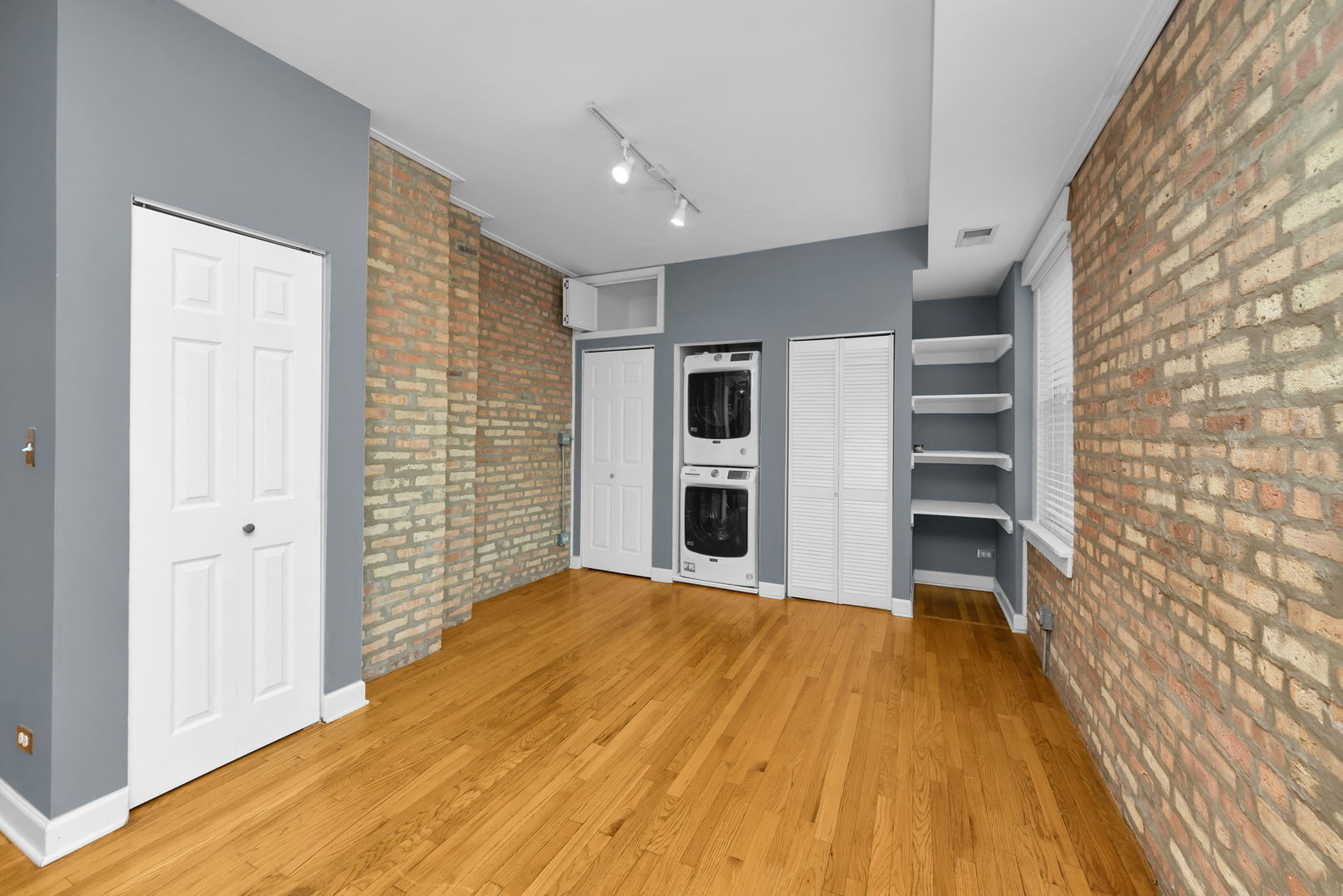4241 North Kimball Avenue, Unit 2 Chicago, IL 60618 - Photo 6 of 16 a view of empty room with a fireplace and cabinet