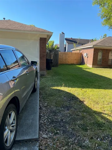 a view of a house with a back yard