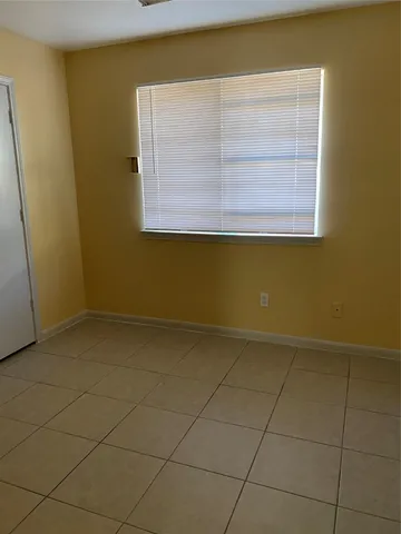 a view of a room that has a window in it