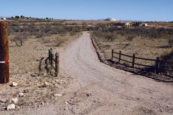 an aerial view of house with mountain view