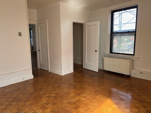 140 Chestnut Street, Unit 402 Springfield, MA 01103 - Photo 11 of 12 a view of an empty room with a window