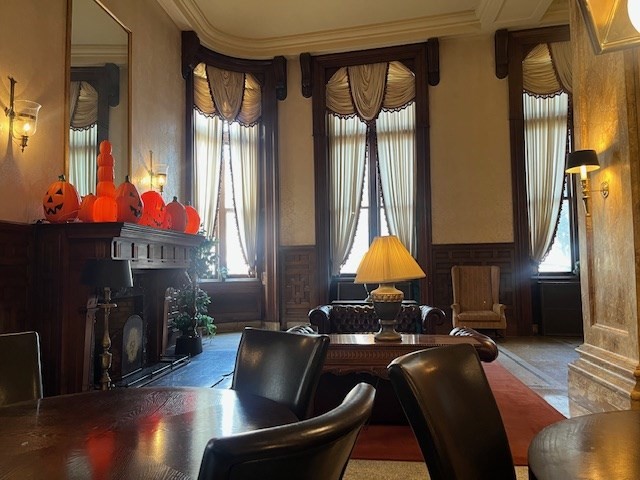 140 Chestnut Street, Unit 402 Springfield, MA 01103 - Photo 2 of 12 a living room with furniture a fireplace and a chandelier