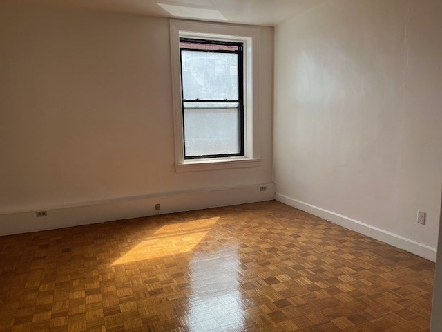 140 Chestnut Street, Unit 402 Springfield, MA 01103 - Photo 10 of 12 an empty room with a window
