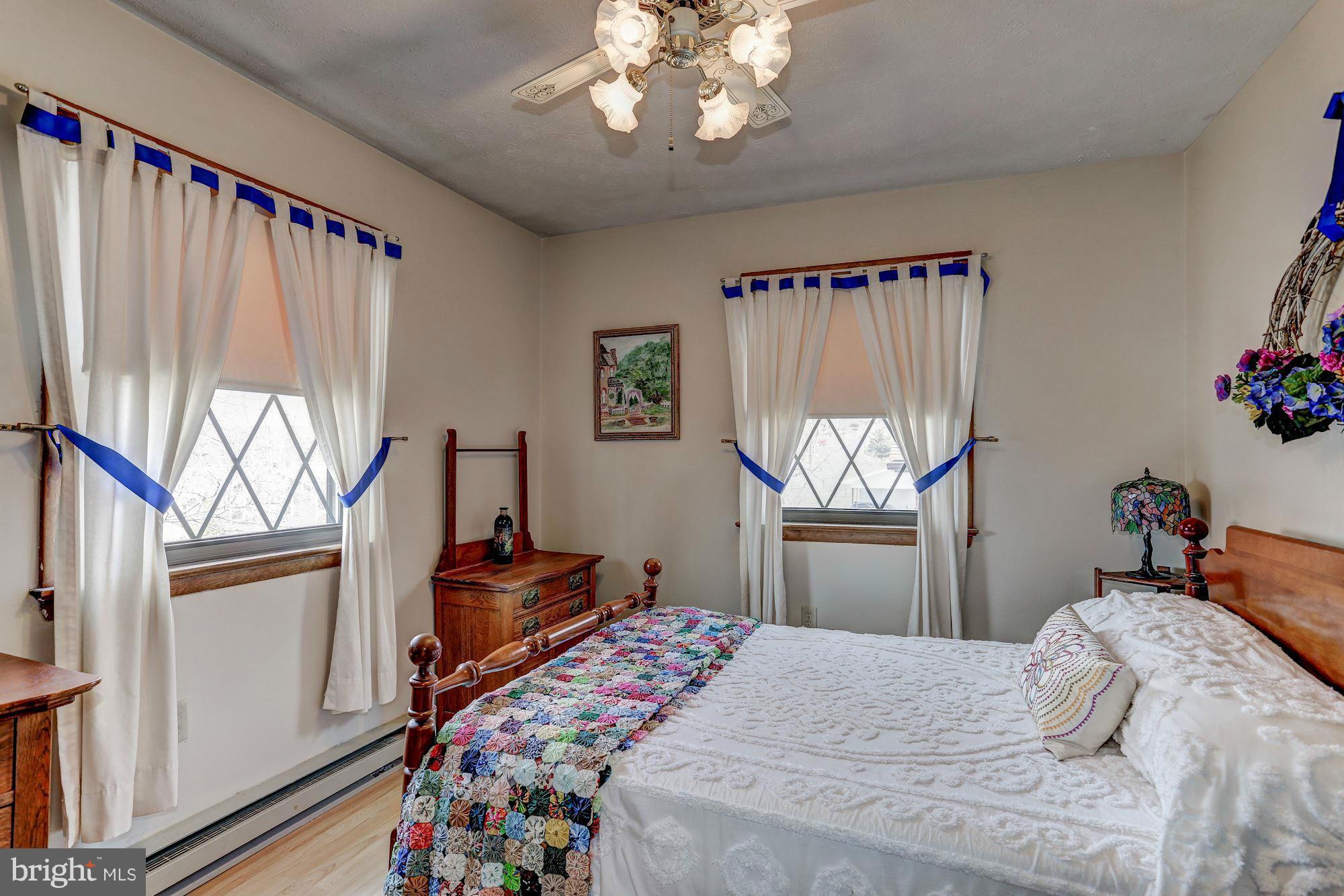 2 Nichols Road Luray, VA 22835 - Photo 15 of 30 a bedroom with a bed and a chandelier