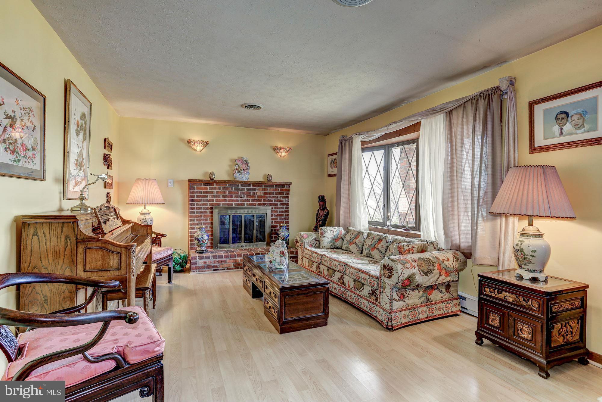 2 Nichols Road Luray, VA 22835 - Photo 2 of 30 a living room with furniture a fireplace and a window