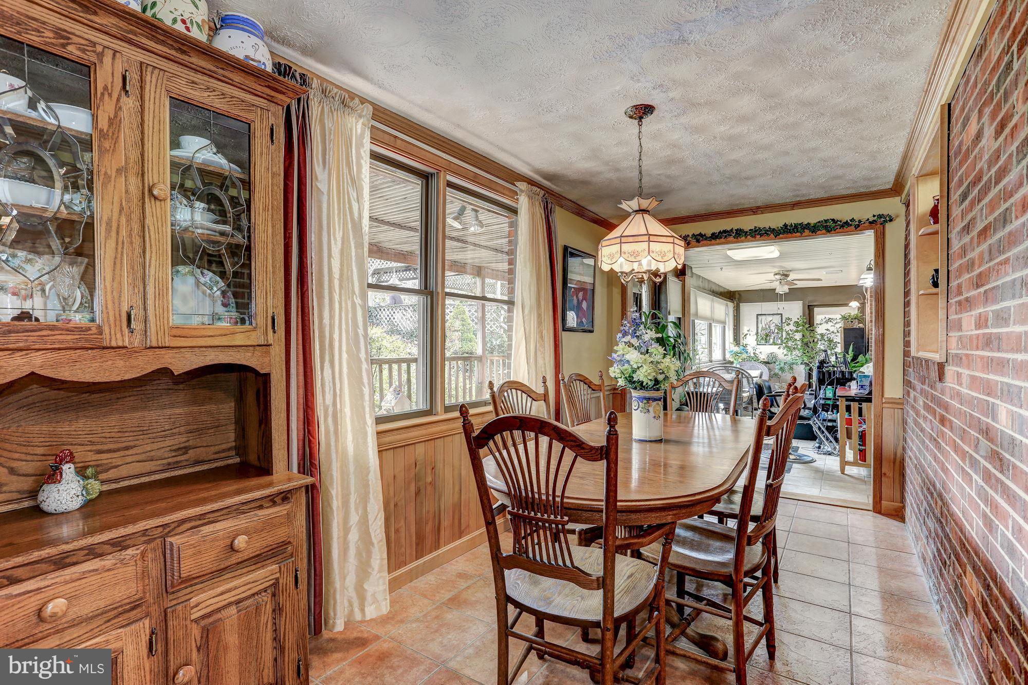 2 Nichols Road Luray, VA 22835 - Photo 6 of 30 a dining room with furniture a chandelier and wooden floor