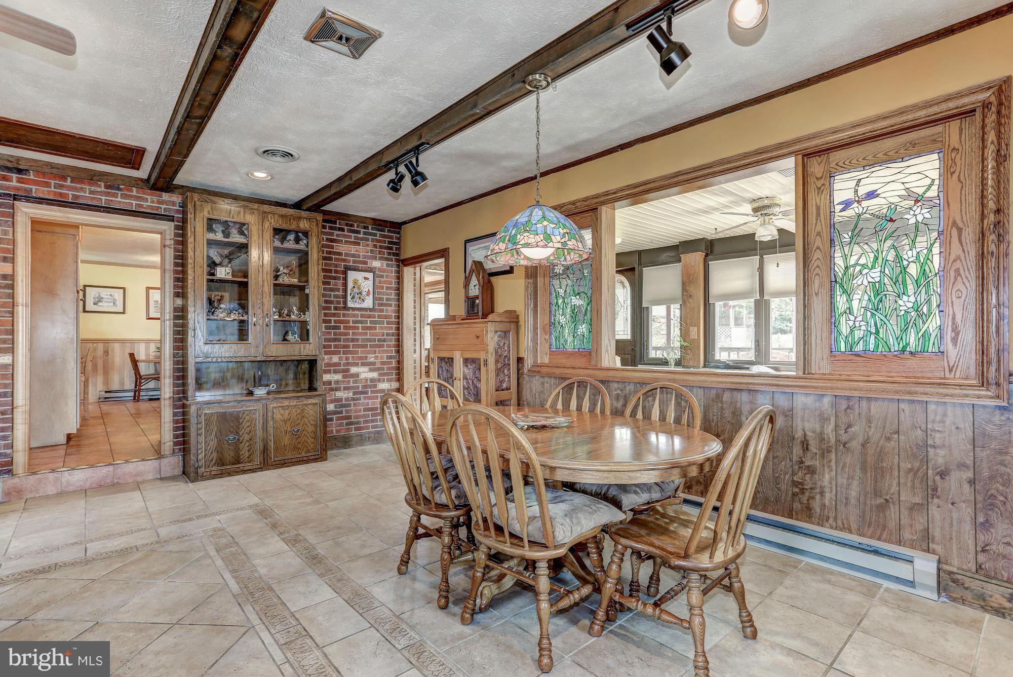 2 Nichols Road Luray, VA 22835 - Photo 8 of 30 a view of a dining room with furniture large windows and wooden floor