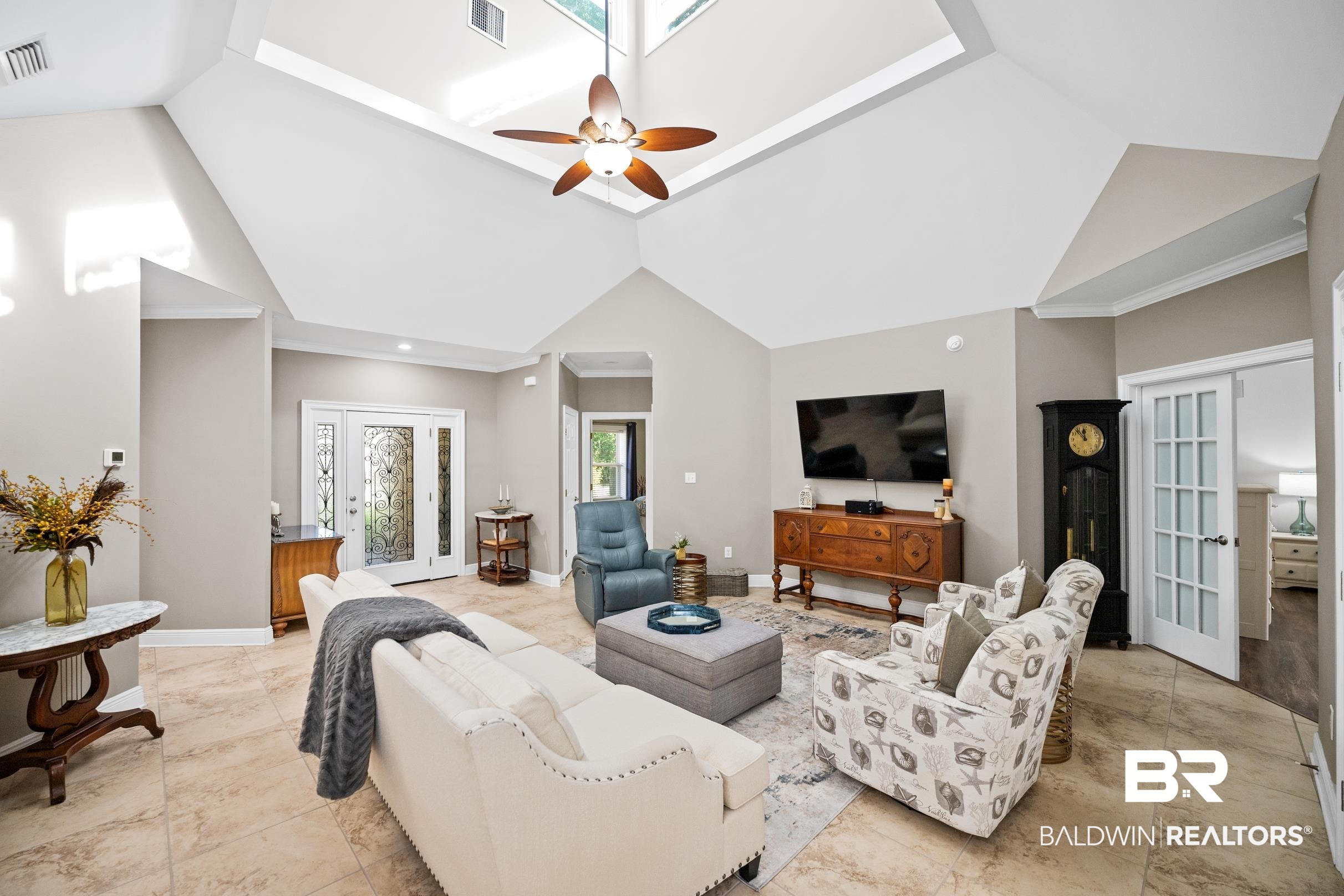 5217 Greentree Road Orange Beach, AL 36561 - Photo 17 of 58 Living area with a ceiling fan, french doors, and high vaulted ceiling