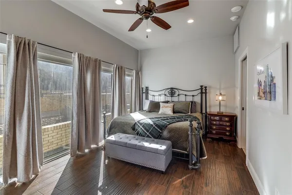 a bedroom with furniture and wooden floor