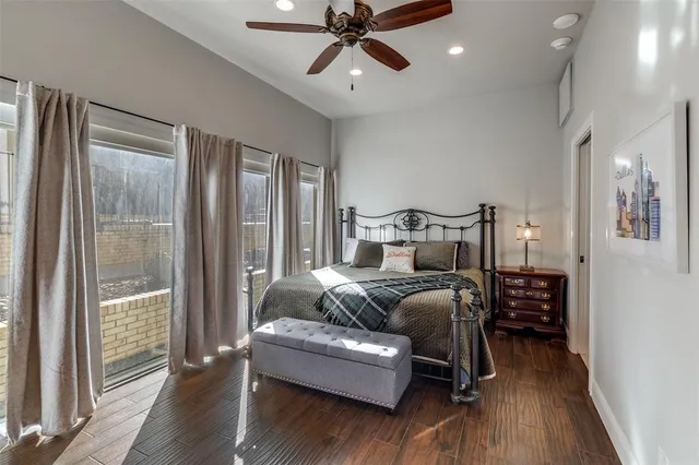 a bedroom with furniture and wooden floor