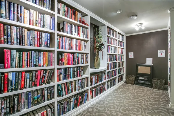 a living room with a book shelf