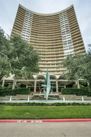 a front view of a building with a yard