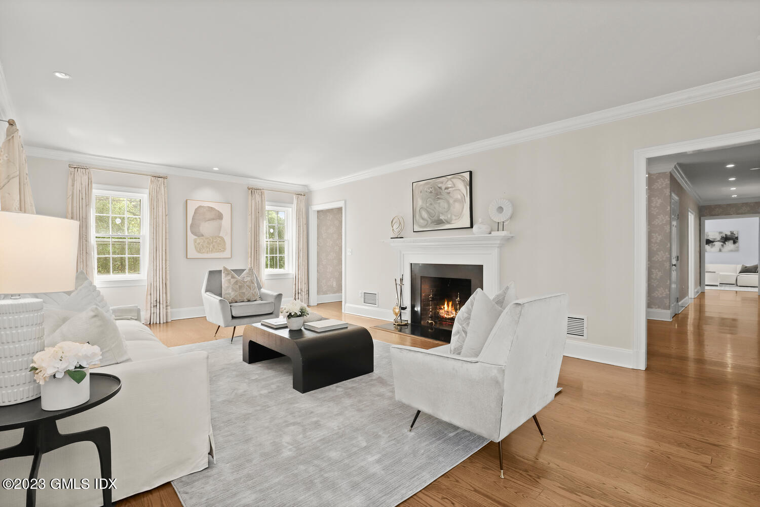 31 Fairfield Road Greenwich, CT 06830 - Photo 5 of 28 a living room with furniture a fireplace and a table