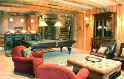 3389 Daybreak Ridge Road Beaver Creek, CO 81620 - Photo 6 of 7 a backyard of a house with couches table and chairs