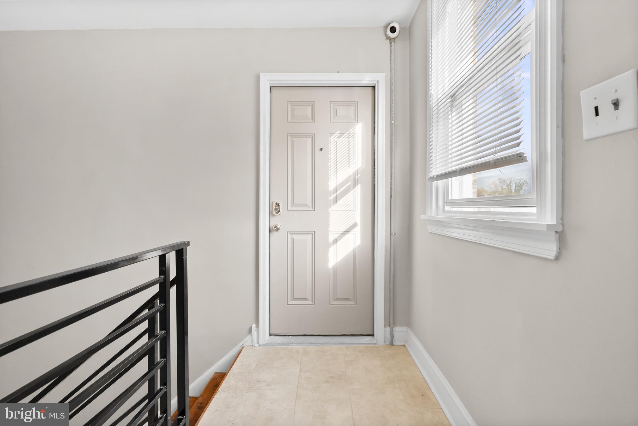 5156 D Street, Unit 2 Philadelphia, PA 19120 - Photo 13 of 23 a view of a hallway with wooden floor and a window