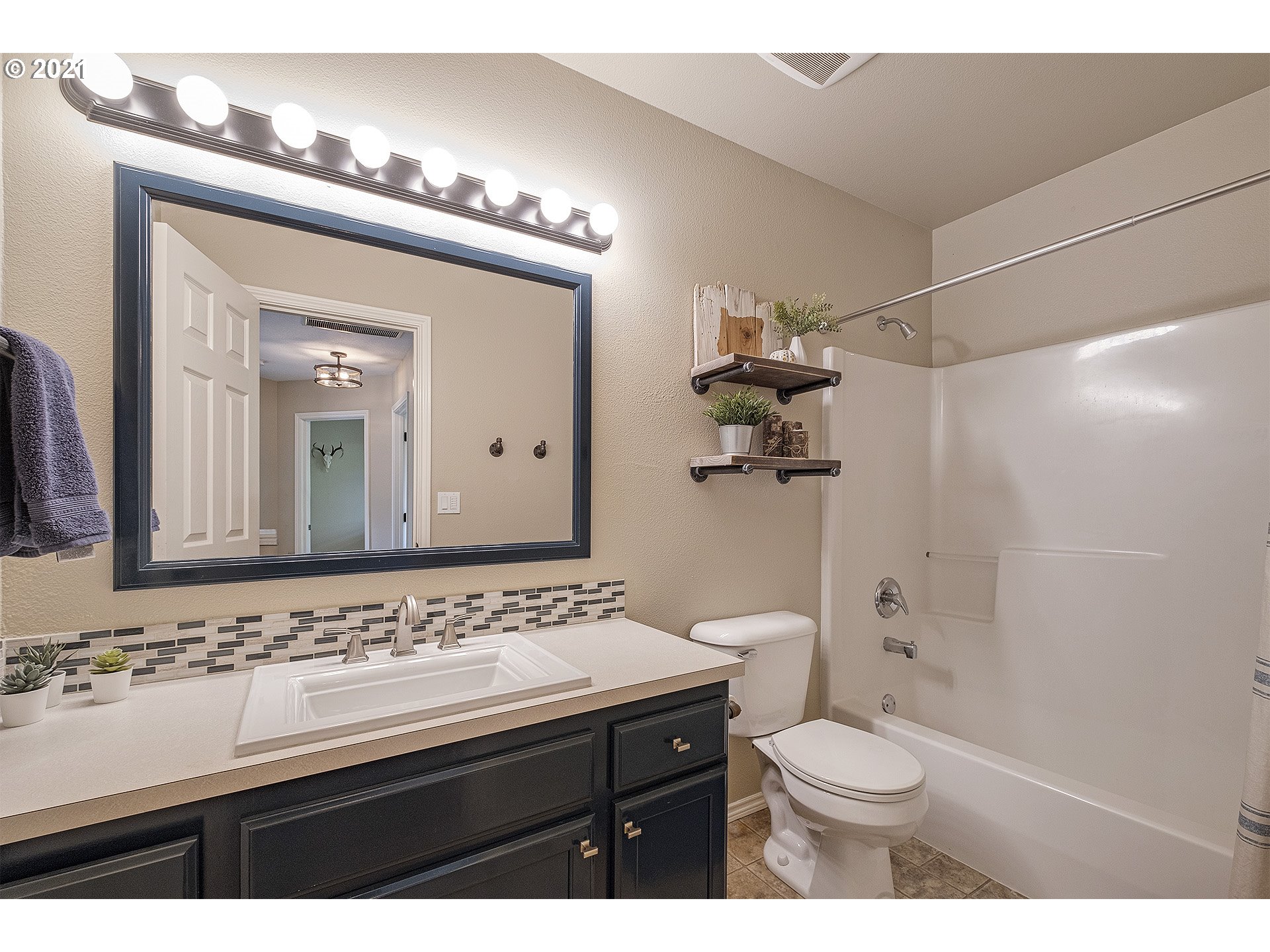 716 Roxe Drive Forest Grove, OR 97116 - Photo 23 of 32 a bathroom with a sink a toilet and shower