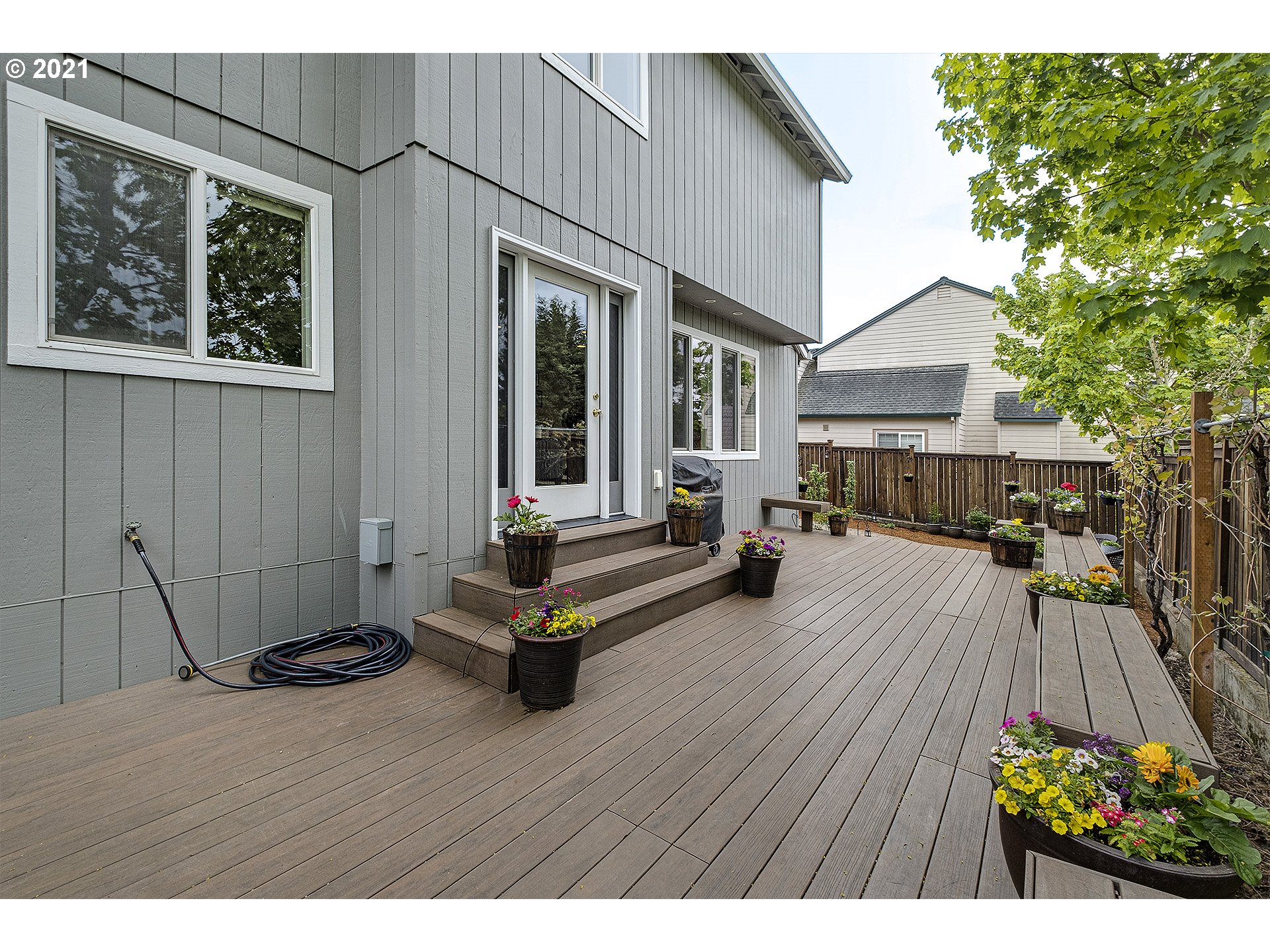 716 Roxe Drive Forest Grove, OR 97116 - Photo 26 of 32 a view of a house with wooden floor and outdoor seating