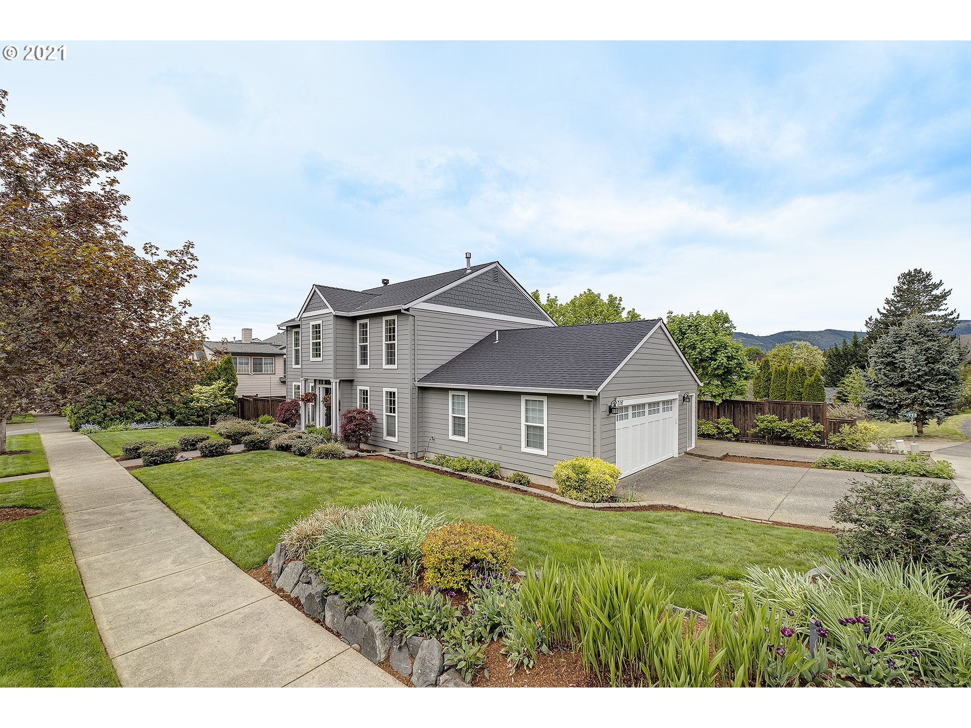 716 Roxe Drive Forest Grove, OR 97116 - Photo 3 of 32 a view of an house with backyard and garden