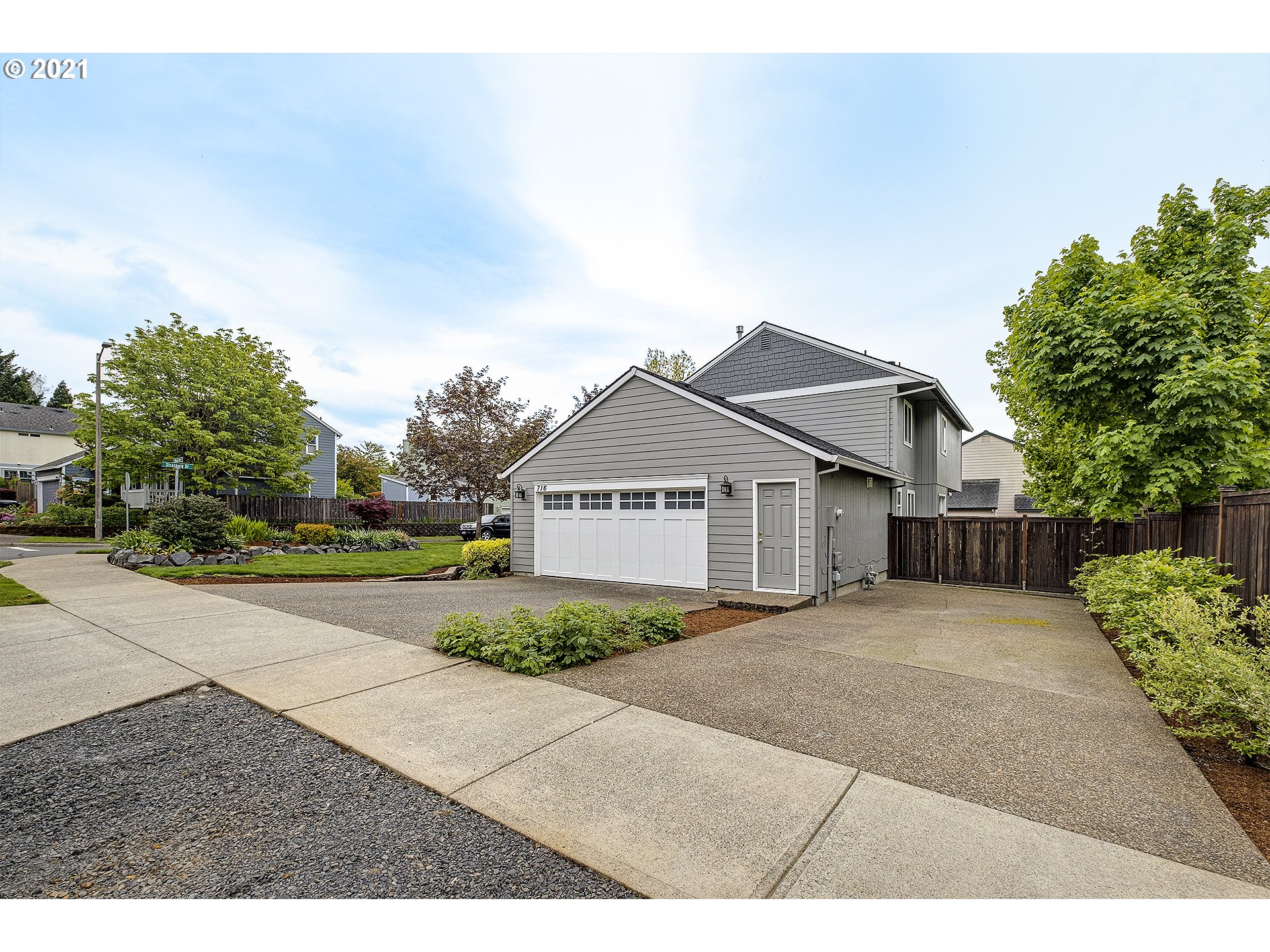 716 Roxe Drive Forest Grove, OR 97116 - Photo 4 of 32 a view of a house with a yard and large trees