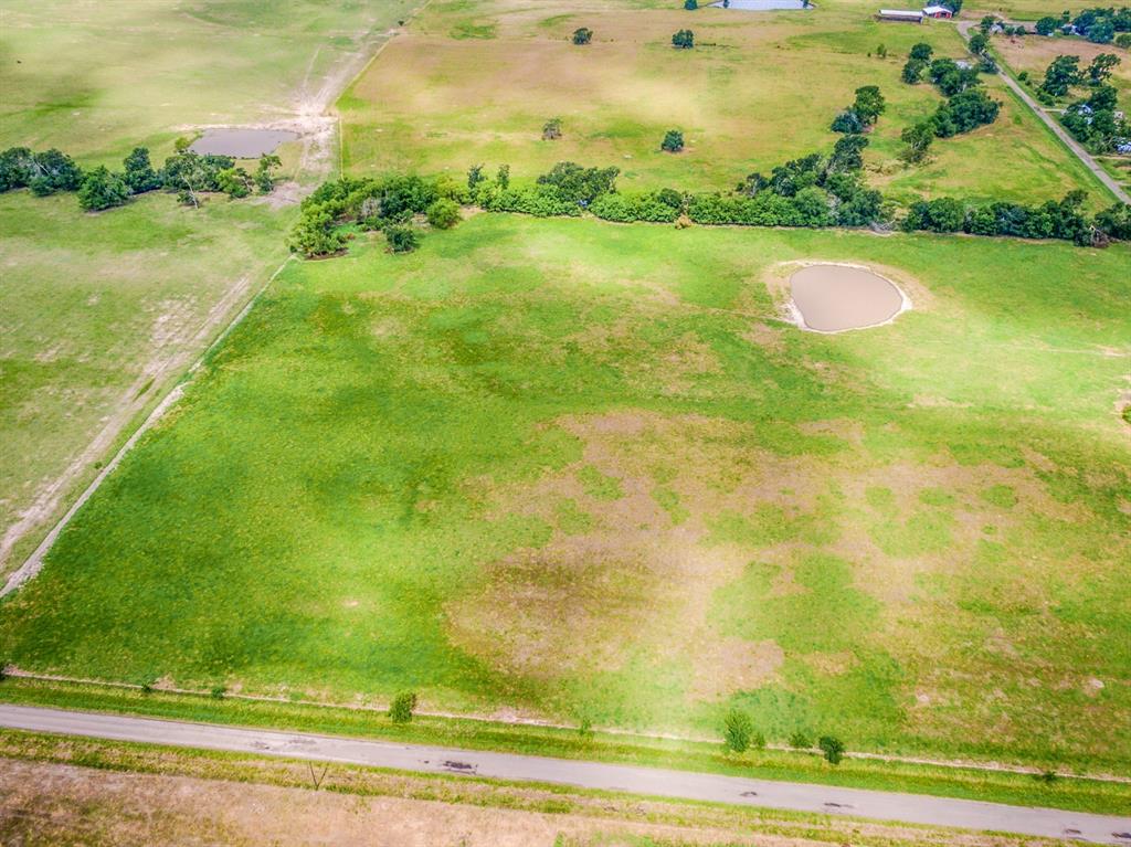 Lot 7 Spring Ranch Sulphur Springs, TX 75482 - Photo 5 of 13 a view of a lake with a big yard