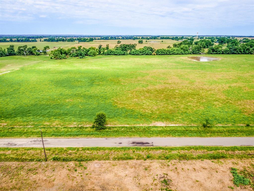 Lot 7 Spring Ranch Sulphur Springs, TX 75482 - Photo 8 of 13 a view of an ocean and a yard