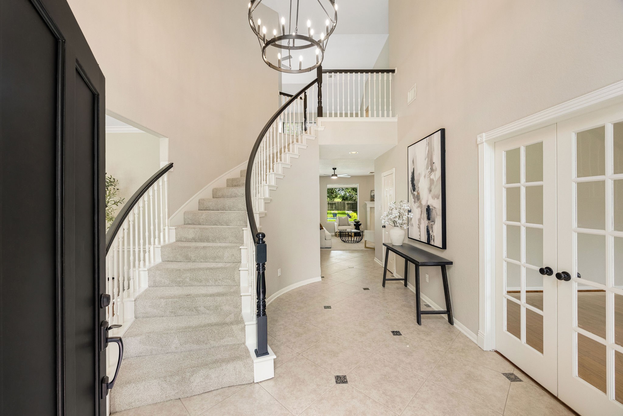9603 Randon Lane Missouri City, TX 77459 - Photo 10 of 50 Grand 2-story entry with a spectacular view of the pool as you enter the home. This is one of 2 staircases.