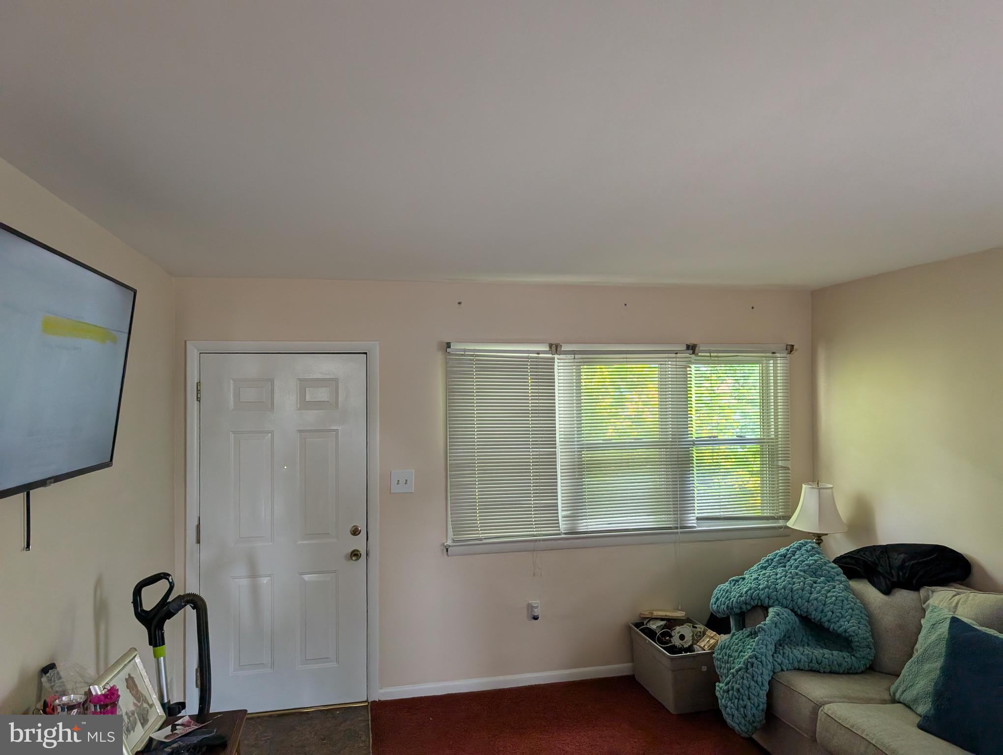 121 69th Street Capitol Heights, MD 20743 - Photo 4 of 11 a living room with furniture and a window