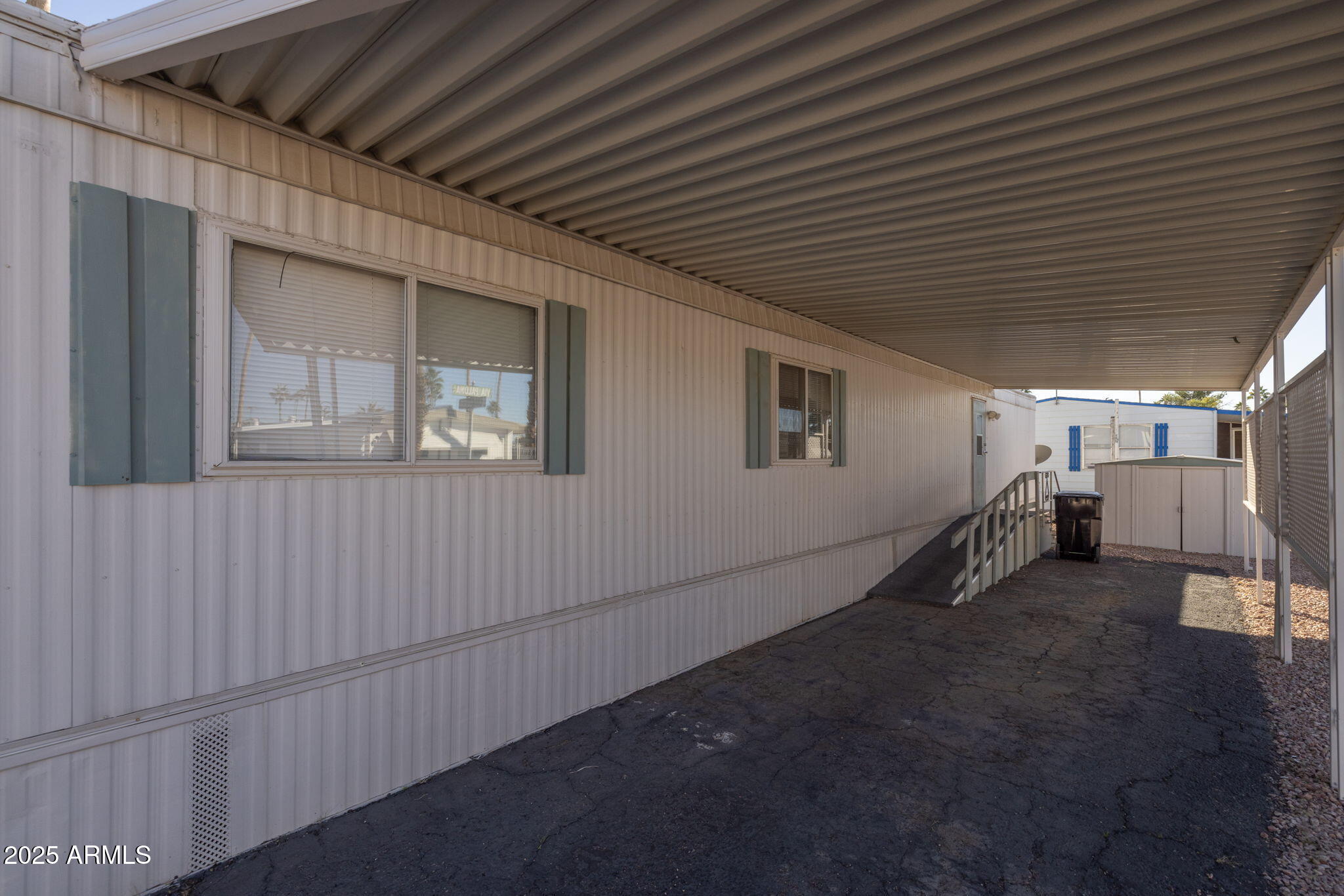 201 South Greenfield Road, Unit 310 Mesa, AZ 85206 - Photo 7 of 34 a view of an empty room with stairs