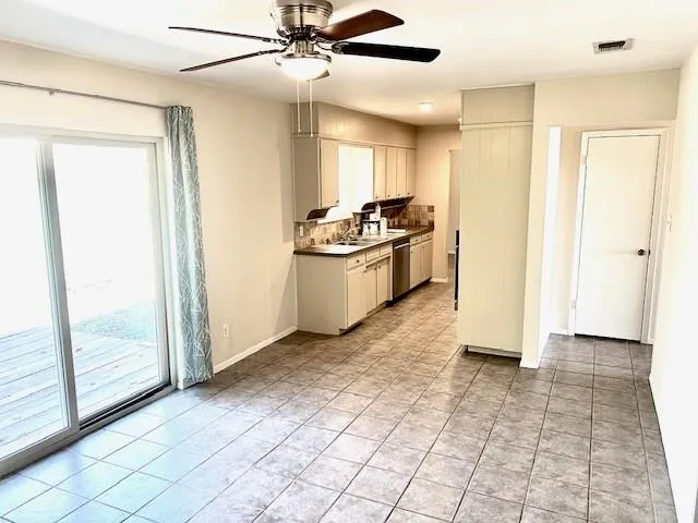 a view of a kitchen with a stove cabinets and a kitchen