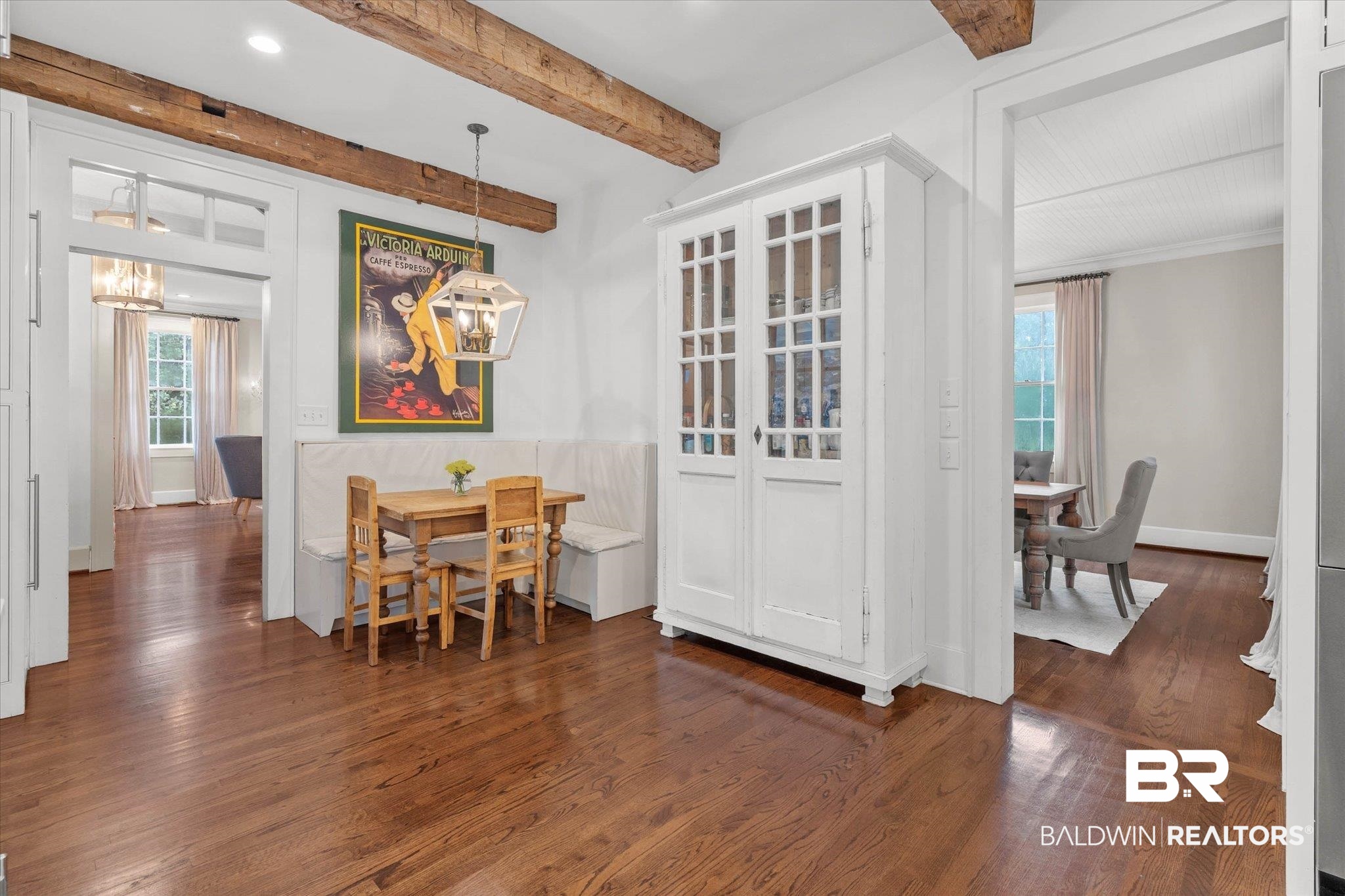 3863 Old Shell Road Mobile, AL 36608 - Photo 16 of 48 Exposed wood beams accenting a white ceiling over wood-finish flooring