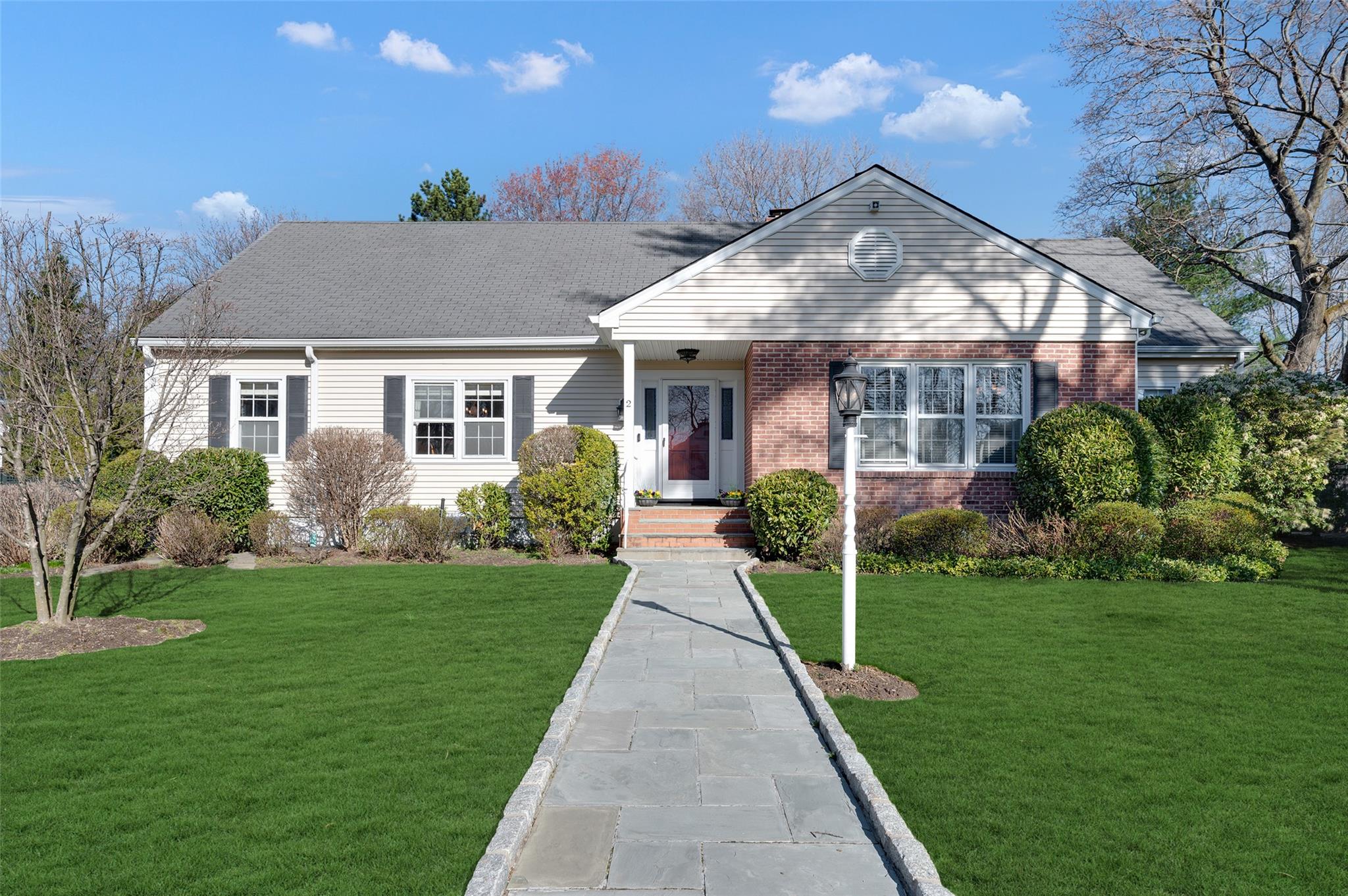 Front of home with bluestone walkway