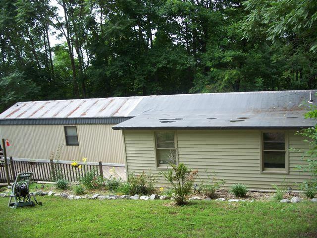 1725 Porters Mountain Road Blue Ridge, VA 24064 - Photo 2 of 13 a backyard of a house with lots of green space