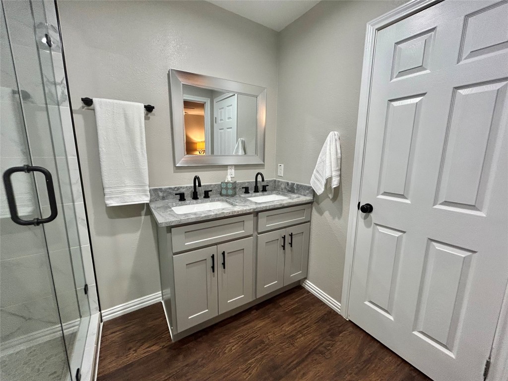 4010 Chapman Street Houston, TX 77009 - Photo 18 of 22 a bathroom with a double vanity sink and a mirror