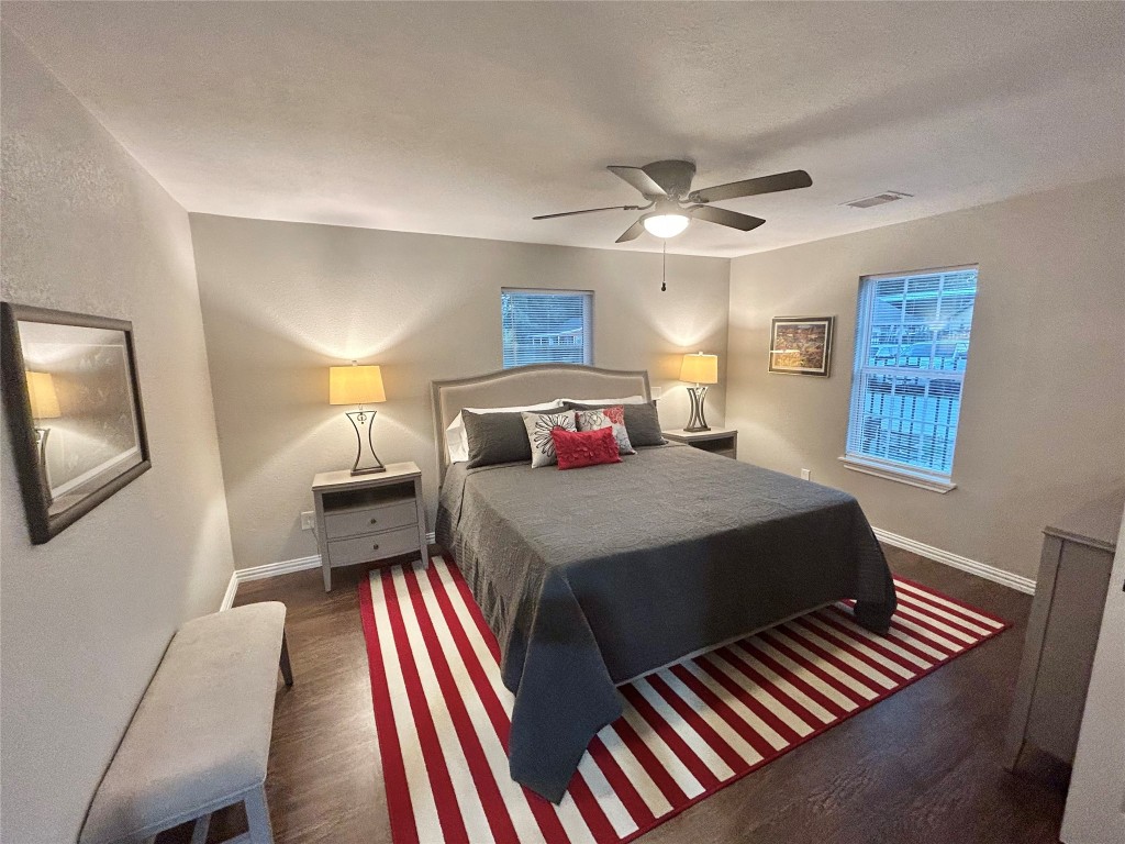 4010 Chapman Street Houston, TX 77009 - Photo 20 of 22 a bedroom with a bed and a chandelier