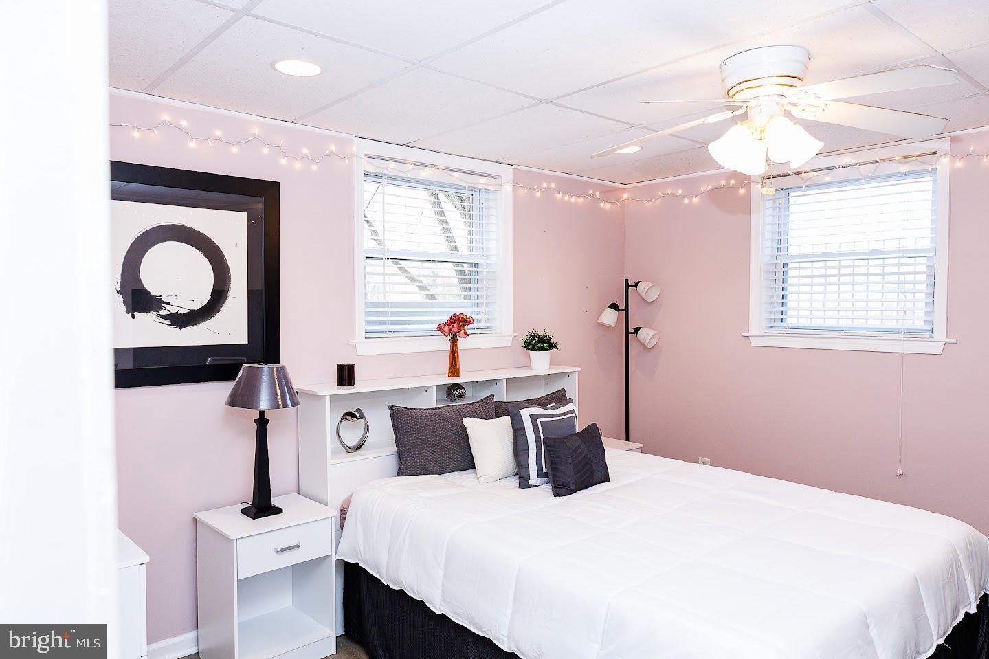 7286 Earlys Road Warrenton, VA 20187 - Photo 3 of 25 a bedroom with a bed and a chandelier