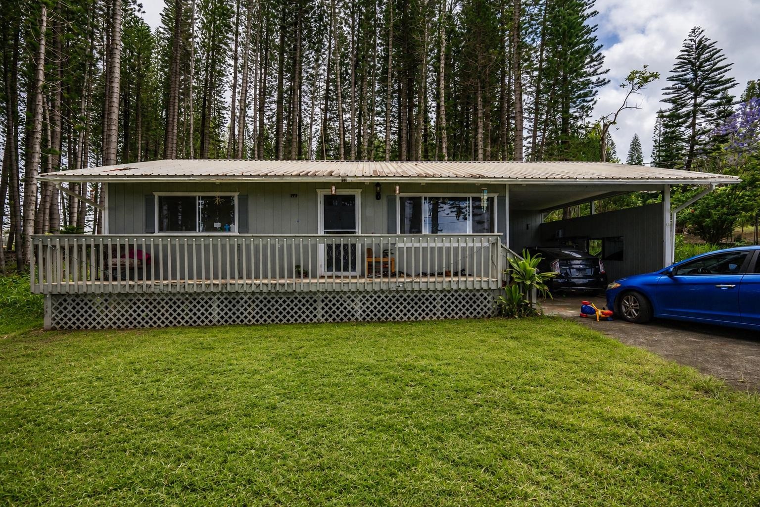 2475 Lilikoi Road Haiku, HI 96708 - Photo 2 of 18 a view of a house with a deck and a yard
